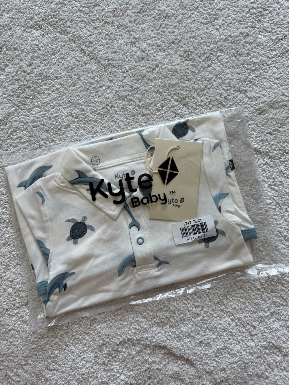 Kyte BABY Cream Short Sleeve Romper with Blue Dolphins & Navy Turtles